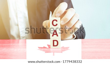 made word CAD with wood blocks with Canada flag