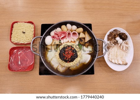 Budae Jjigae, Korea noodles hot pot,noodle,beef,mushroom on the table