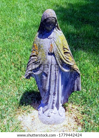 Picture taken in Kentucky of a Weathered statue of Mary.