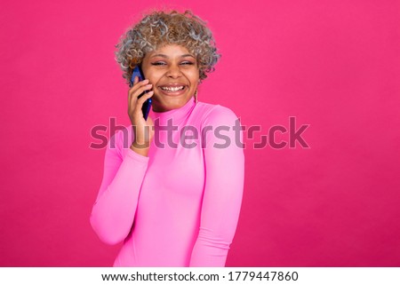 girl or woman with smartphone and sport clothes isolated on color background