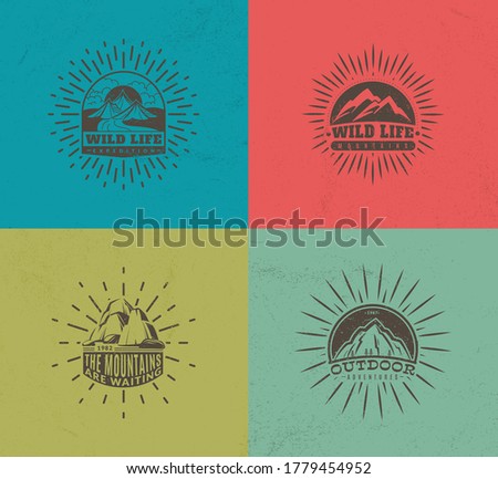 Mountain emblems. Set of four vector colored vintage badges, mountaineering camp and adventure tourism, hiking expedition retro labels, vector monochrome isolated illustration collection