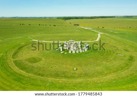 Aerial view of Stonehendge on a sunny day in summer with no people around. This is a historic site with a ring of standing stones, it was believed to be a burial site. Royalty-Free Stock Photo #1779485843