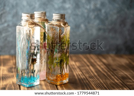 Herbarium glass made with dry flower and oil
