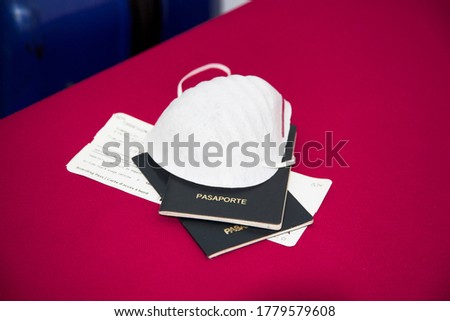covid 19 medical mask and pasport Royalty-Free Stock Photo #1779579608