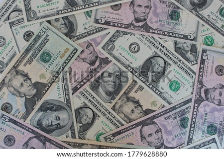 Dollars of different denominations in bulk, one, five, twenty, one hundred dollar bills Royalty-Free Stock Photo #1779628880
