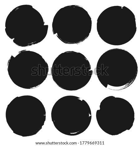 Set of vector circles grunge black stickers isolated on white background. A group of labels with uneven rough edges drawn with an ink brush. Vector design elements, 9 circle frames. Grunge backgrounds