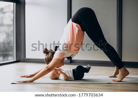 Mother with little baby boy practice yoga Royalty-Free Stock Photo #1779703634