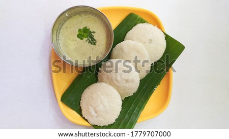 South Indian cuisine famous known as Idli and the green chutney serverd on the banana leaves has a very different taste. It is very famous in the south region of India 