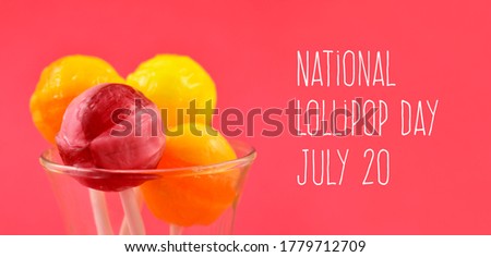 National Lollipop Day stock images. Pink and yellow round lollipops on a pink background images. Lollipop Day Poster, July 20