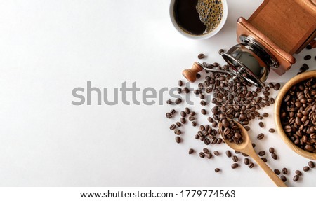 cup of coffee and bean on white table background. top view