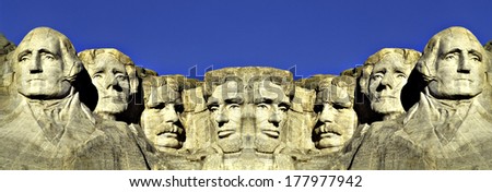 This is a digitally created image. It is a double image of Mount Rushmore connected at its center against a blue sky.