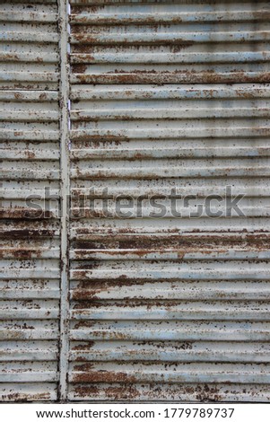 Old metal sheet texture. Rusted fence with welding.