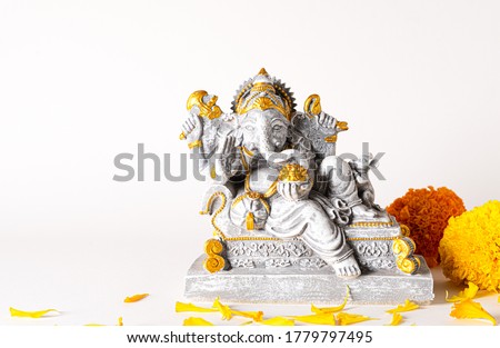 Happy Ganesh Chaturthi festival, Lord Ganesha statue with beautiful texture on white background, Ganesh is hindu god of Success. Royalty-Free Stock Photo #1779797495
