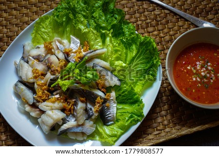 Boiled Pangasius Fillet  fish and spicy sauce.