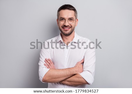 Close-up portrait of his he nice attractive cheerful cheery content mature man skilled it specialist lawyer attorney wearing specs folded arms isolated over light gray pastel color background
