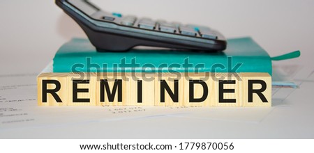 Word reminder made with wood building blocks,stock image. High quality photo