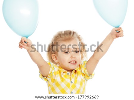 Full isolated studio picture from a little girl with blue balloons