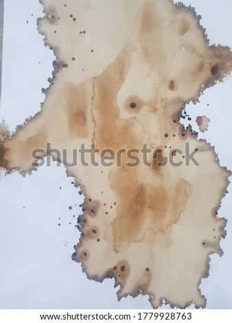 coffee was spilled on a white sheet