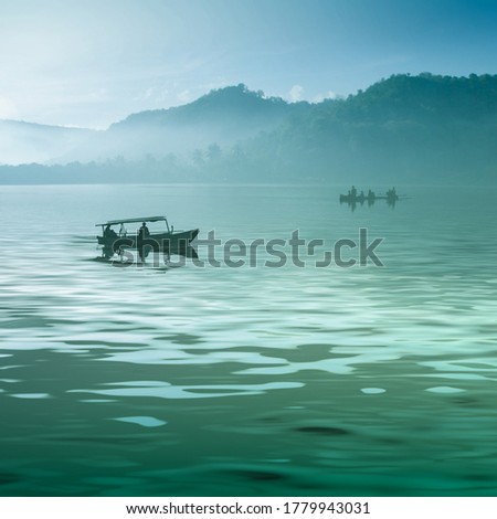 Two boats on the silent green lake