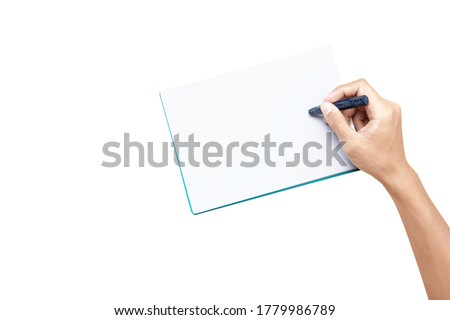 Hand with a crayon drawing in the book isolated over white background