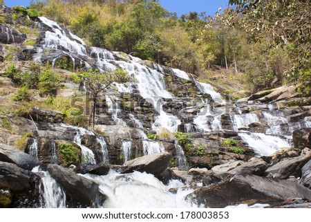 waterfall in thai national park. In the deep forest on mountain.