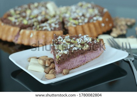 chocolate and pistachio cake on the table