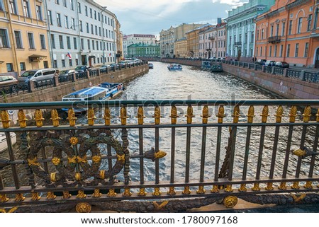 Decorative fence of Great Konyushenny Bridge above Moika River. Saint Petersburg, Russia