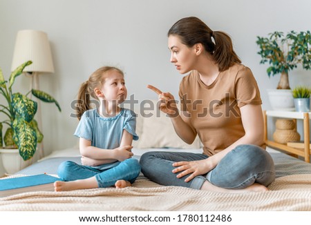 mother is scolding her child girl. family relationships Royalty-Free Stock Photo #1780112486