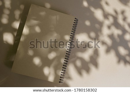 Dairy book with plant shadows. Holiday composition. Daily planner.