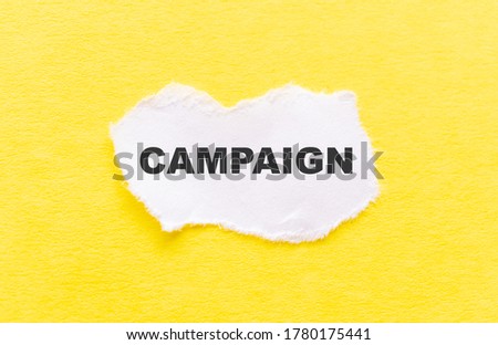 campaign word written on wood block. campaign text on table, concept.