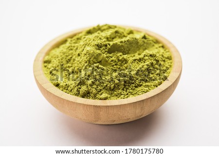 Herbal henna or Mehandi powder in a bowl forming heap, Used for Tattoo or Hair Dye in India