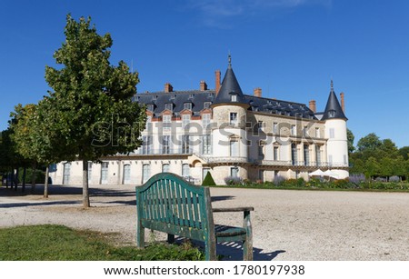 View of Rambouillet castle , XIV century in picturesque Public Park in town of Rambouillet. Yvelines department , 50 km southwest of Paris. France.