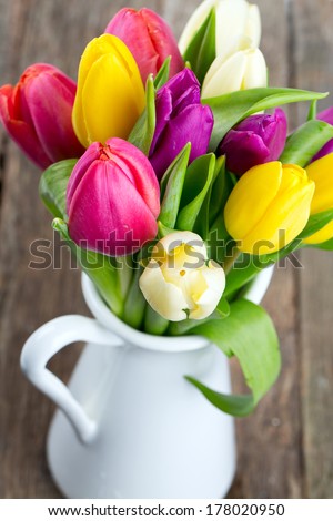 tulips on a wooden table