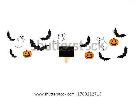 Halloween mock up concept.  Flying black paper bats , pumpkins and ghosts, black tag on white background. 