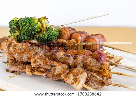 Pictures of grilled pork with spicy hot and spicy Szechuan pepper sauce, local street food and spicy Thai food