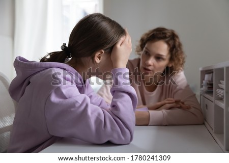 Strict mother scolding upset depressed teenage daughter for bad marks or school exam results, angry mum lecturing lazy unmotivated teen girl, generations, parent and child conflict Royalty-Free Stock Photo #1780241309