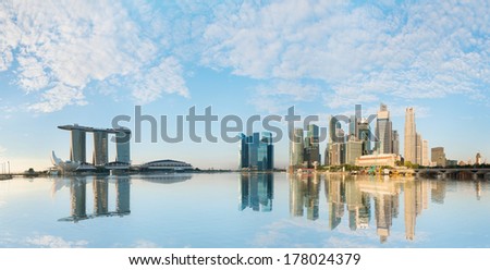 Singapore skyline of business district with skyscrapers and Marina Bay Sands at morning under blue sky