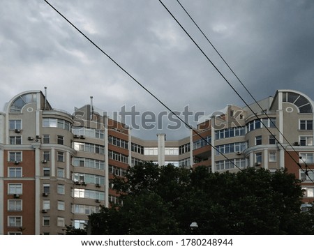 multi-storey residential buildings against a stormy sky