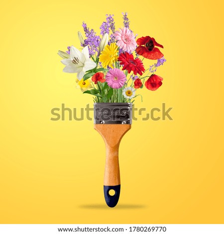 Tassel or brush for drawing and painting with bright flowers