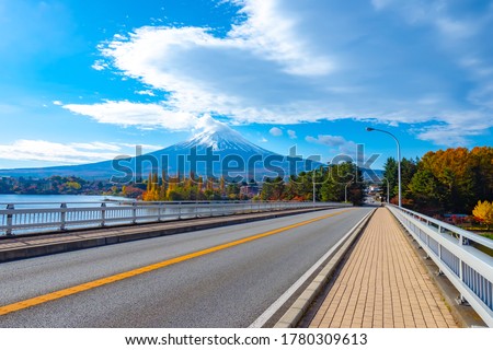 Japan. Deserted road on the background of mount Fuji. Fujisan. The top of mount Fuji in the clouds. Drive to lake Kawaguchiko. Symbol Of Japan. The Japanese landscape. The Nature Of Japan. Royalty-Free Stock Photo #1780309613