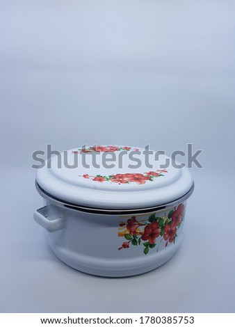 Vintage enamelware in white photo stock