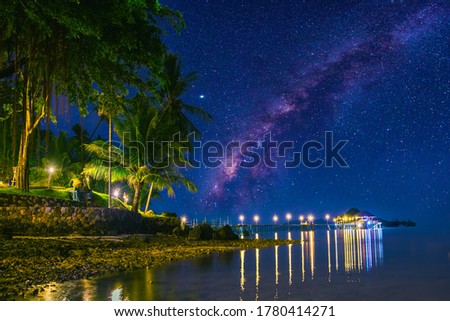 Milky Way galaxy, On Koh Mak Trat, Thailand,Long exposure photograph, with grain.Image contain certain grain or noise and soft focus.