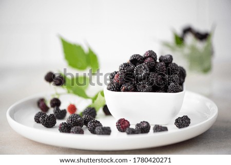 ripe black forest raspberries in a glass