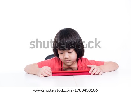asian chinese child playing tablet, kid watching cartoon
