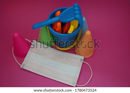 
Bucket and beach accessories summer edition with a covid-19 mask