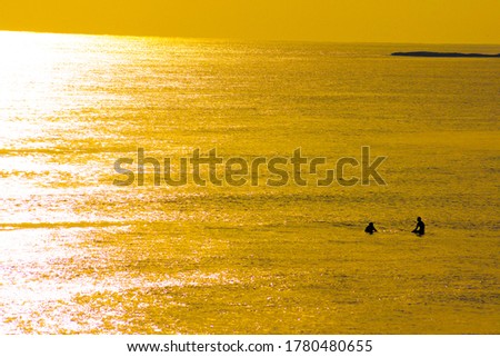 Surfer silhouette and dusk of Kamakura coast