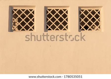 Traditional Aegean architecture three wooden windows.