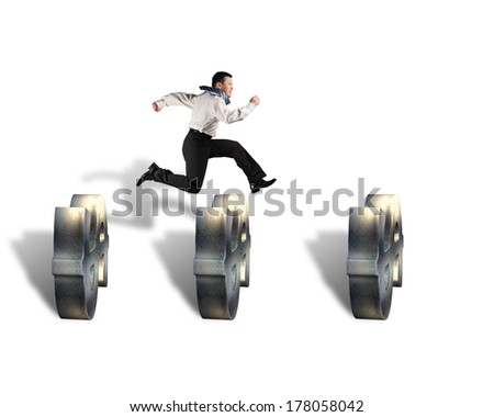 businessman jumping over money symbol obstacles isolated in white background