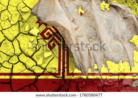 flag is pictured on cracked ground. The Concept of Ecology with Environmental Pollution from Domestic and Industrial Waste.