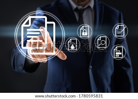 Man pointing at document icon on virtual screen, closeup